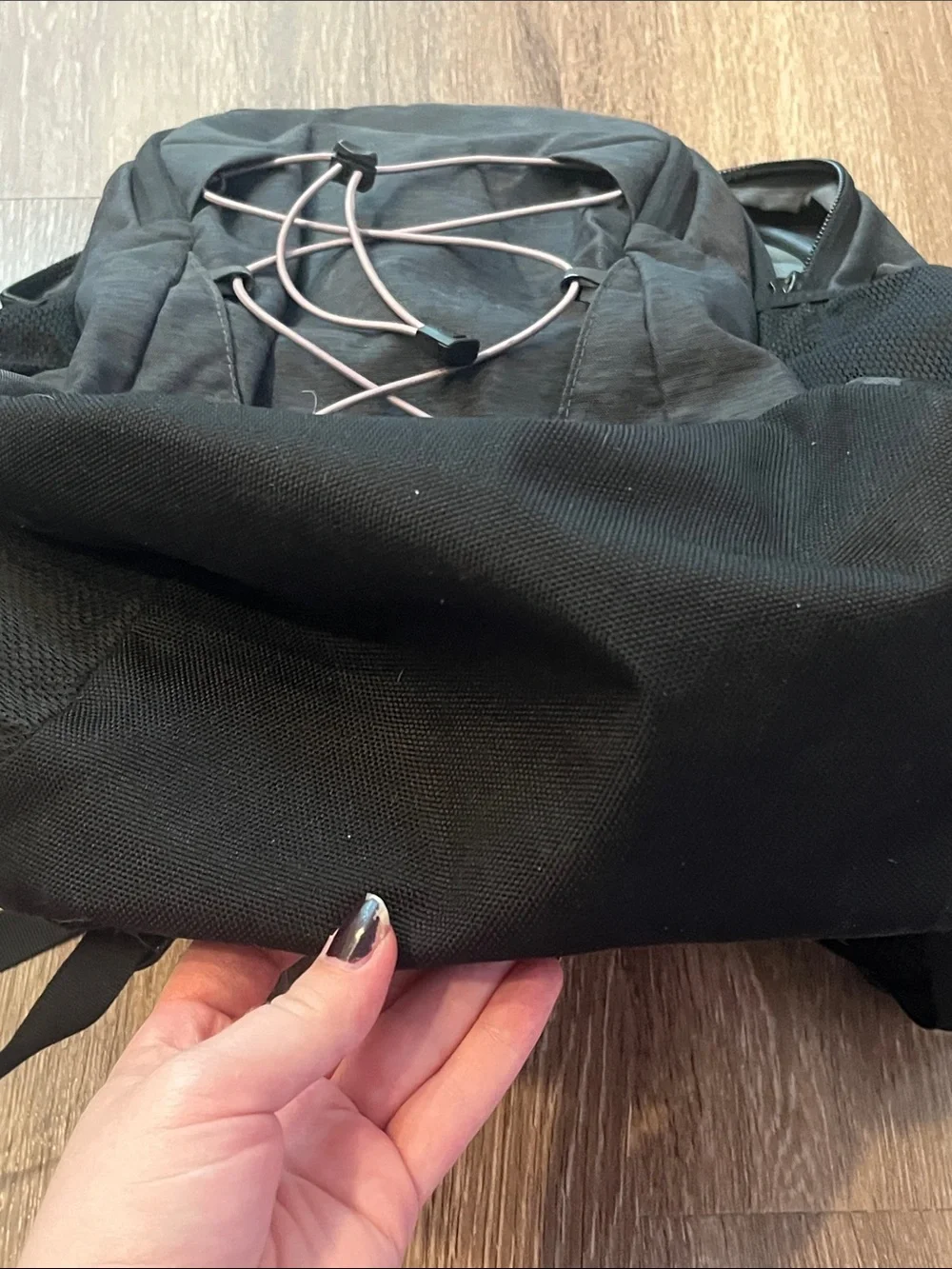 The NorthFace Jester Black Backpack with Light Pink Bungee Cord